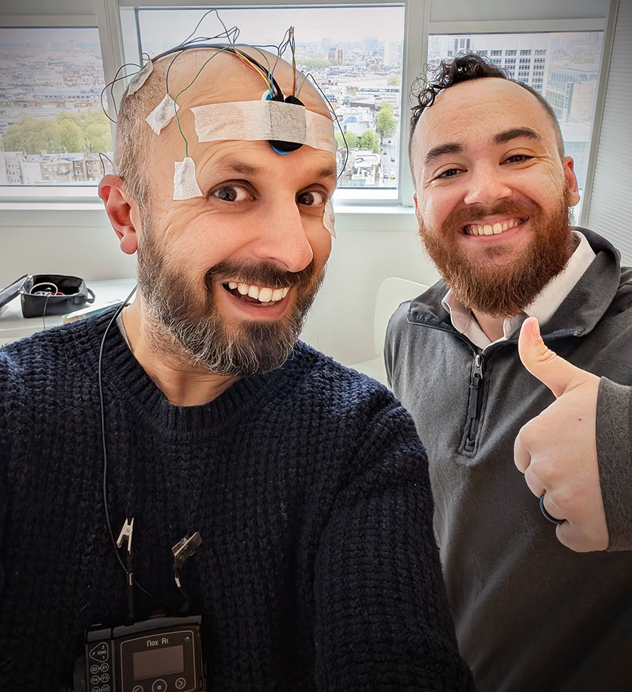 Professor Vik Veer wearing an EEG montage during the K-complex sound experiments, alongside Michael Storey